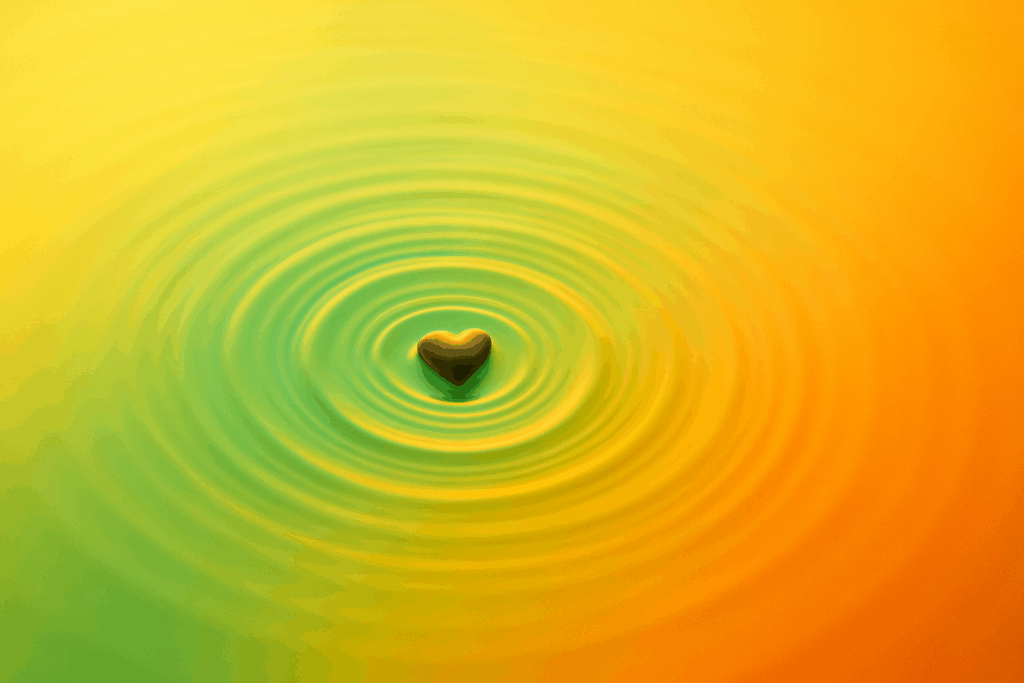 Practicing emotional validation creates ripple effect: heart radiating concentric waves symbolizing how genuine acceptance spreads healing through relationships.