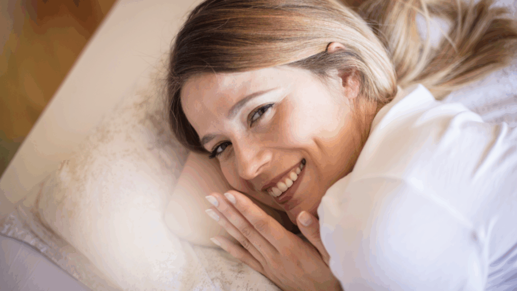Woman sleeping peacefully on a pillow, demonstrating the importance of sleep in supporting dopamine detox through neuroscience-based approaches to brain recovery.