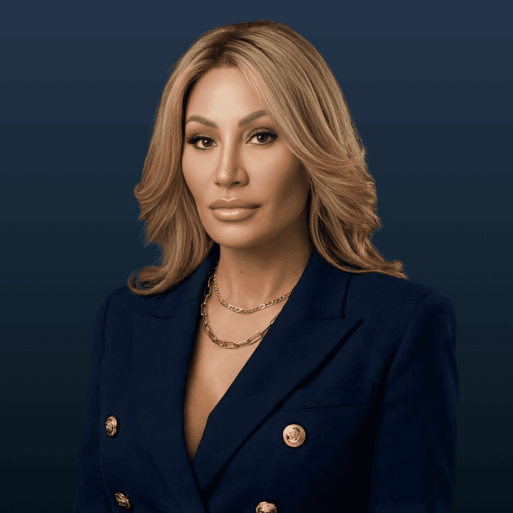 Dr. Sydney Ceruto, founder of MindLAB Neuroscience and creator of Real-Time Neuroplasticity™, wearing professional navy blazer against blue background