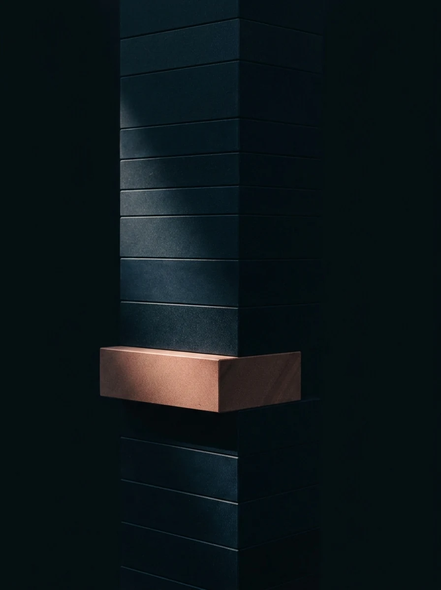 A column of dark stone slabs with one slab lit in copper pushed out of line, the rest holding true above